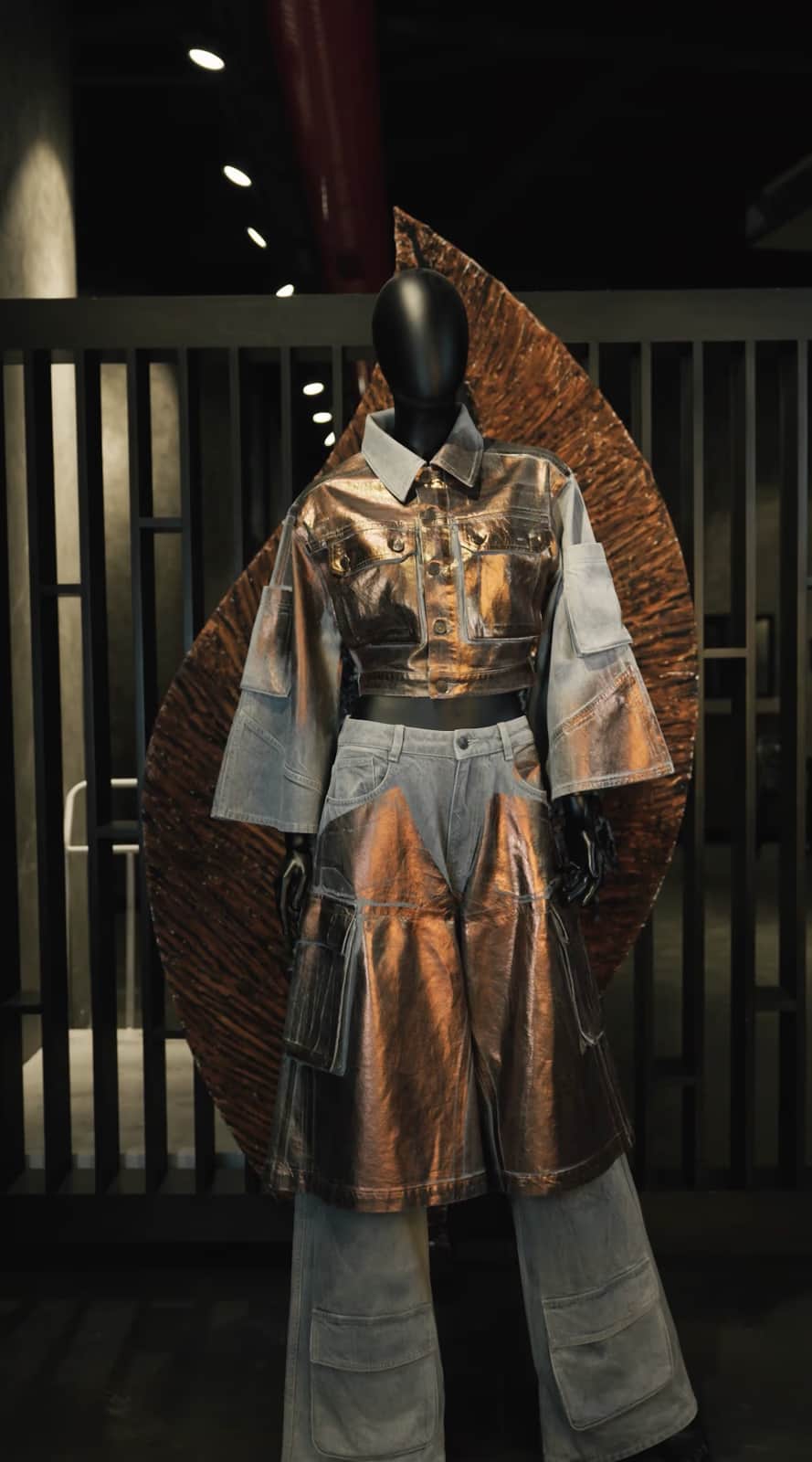 ALLDENIMS reconstructed denim look — metallic bronze and grey denim on a mannequin