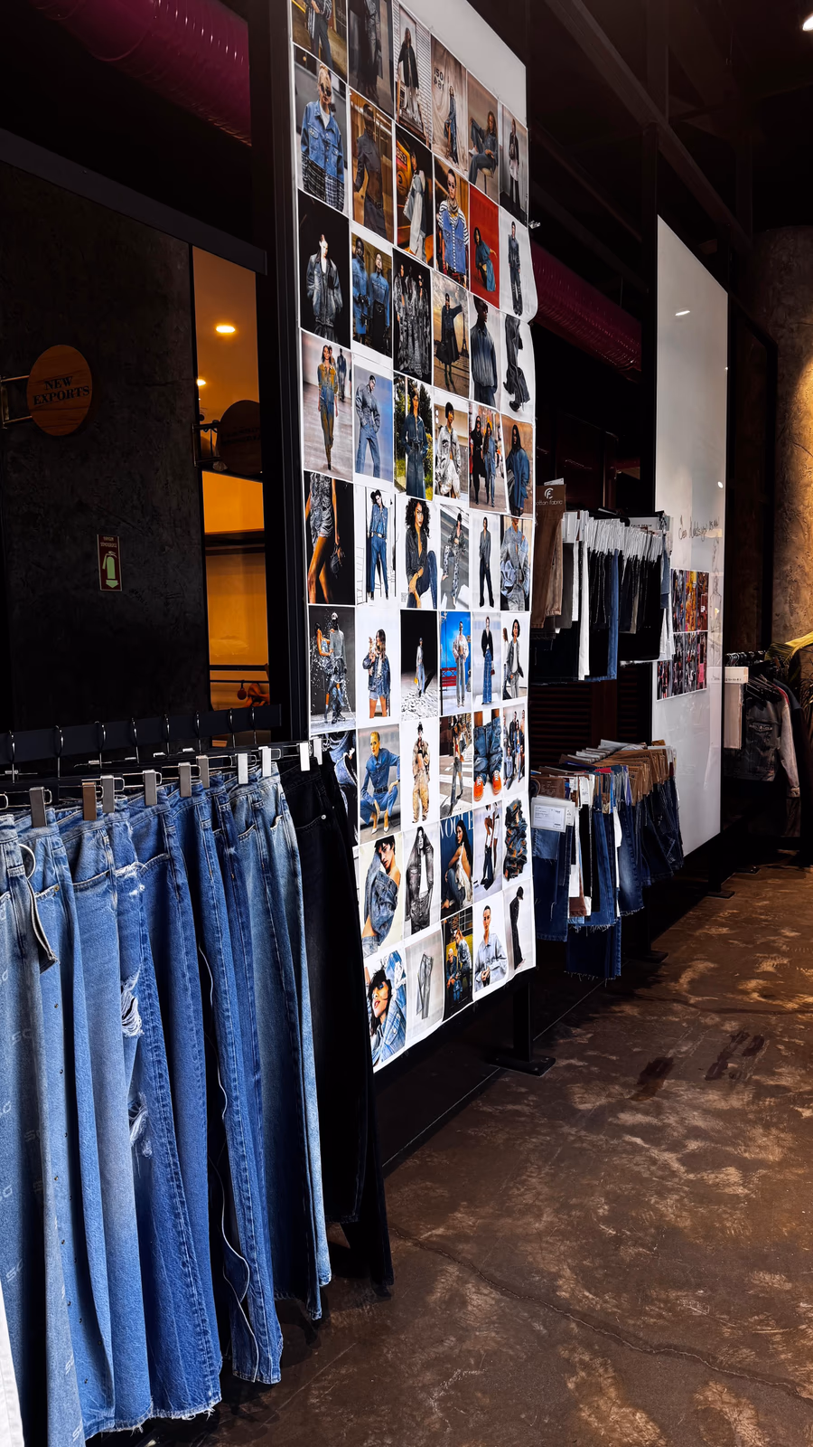 ALLDENIMS studio — denim racks and fashion mood board in the showroom
